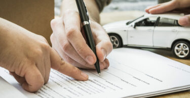 Auto insurance policy signature. Home owners insurance paperwork.