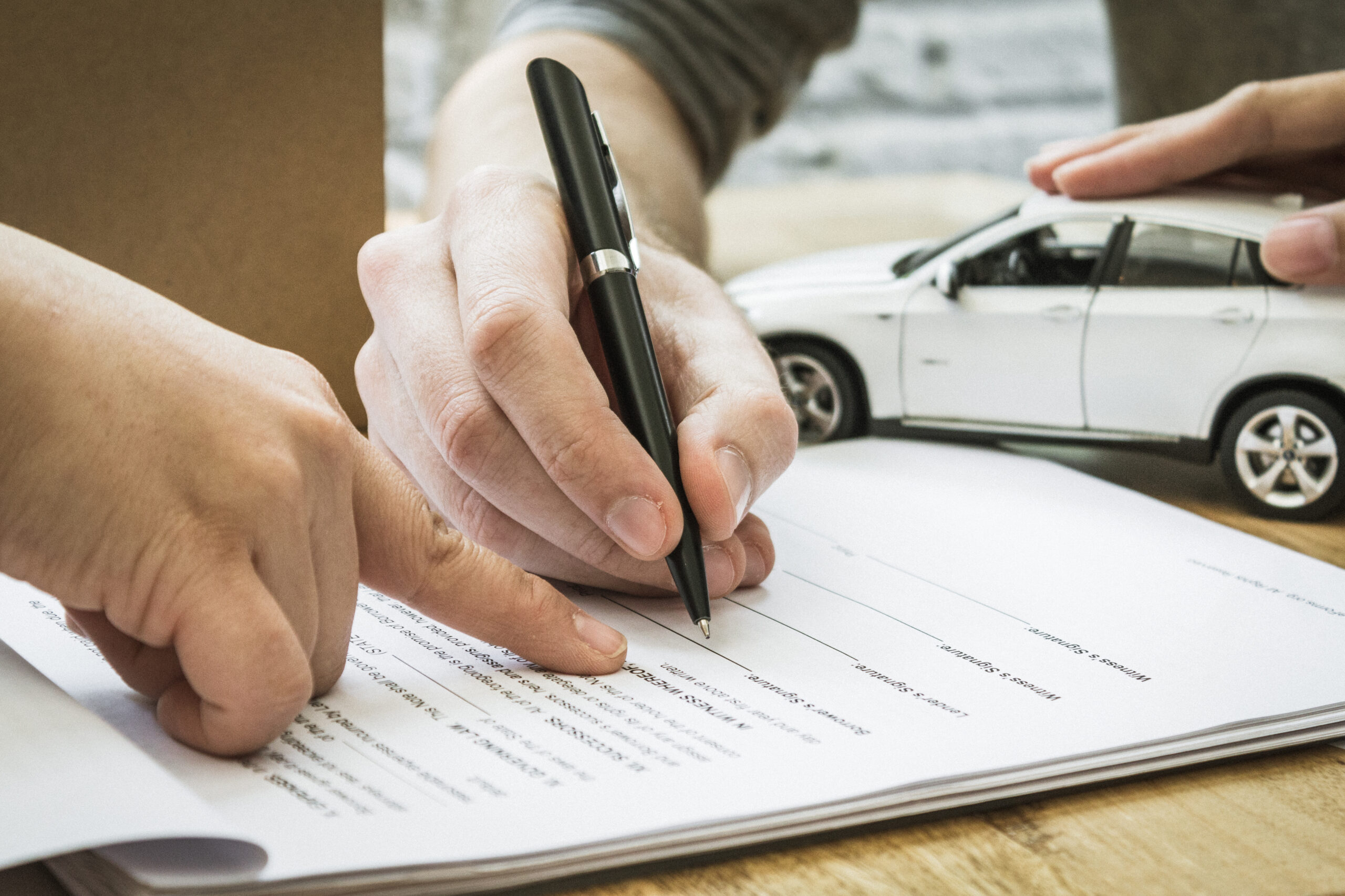 Auto insurance policy signature. Home owners insurance paperwork.